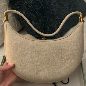 White faux leather purse with adjustable straps